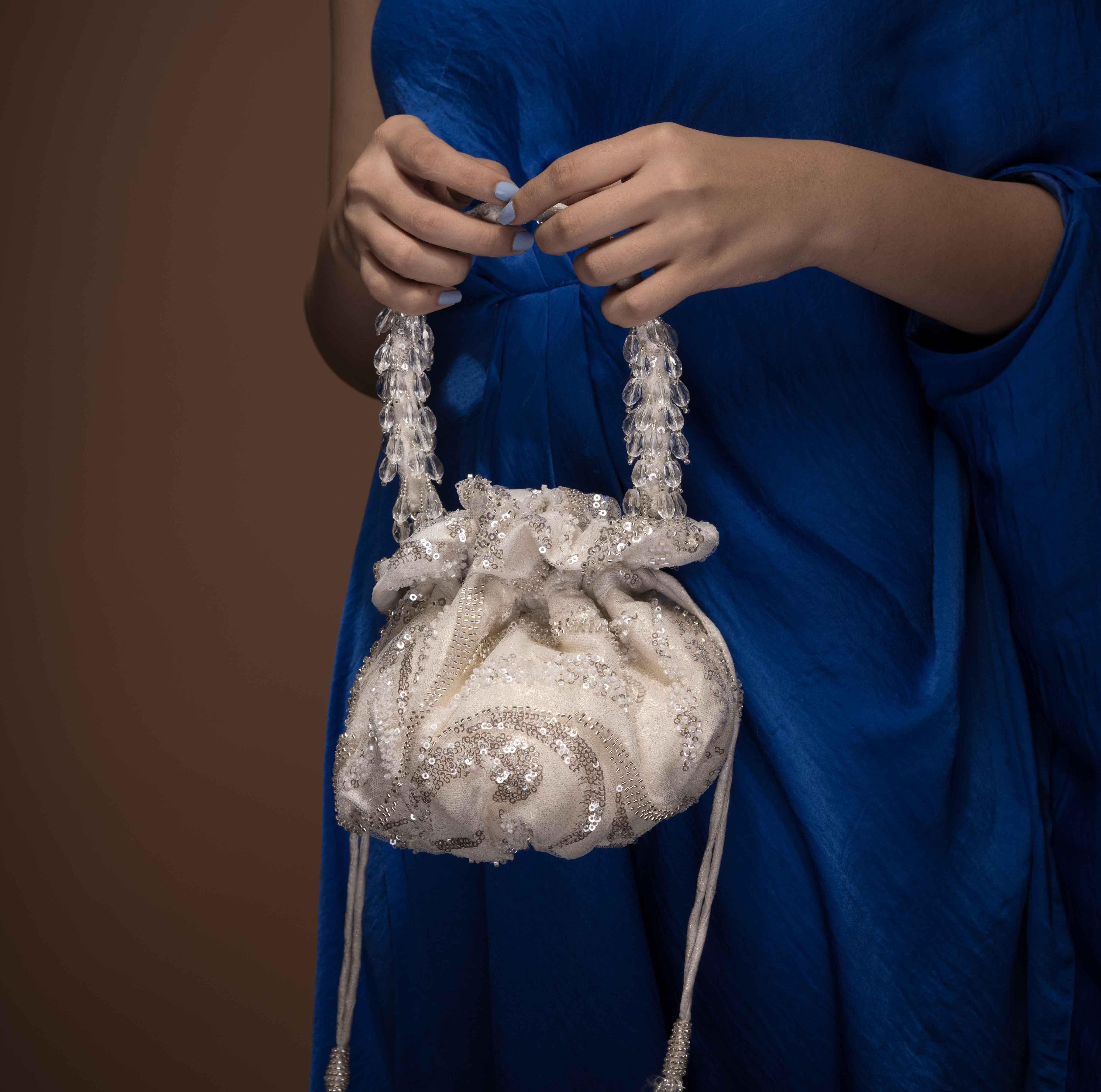Ivory and Silver gol potli bag - Ozel