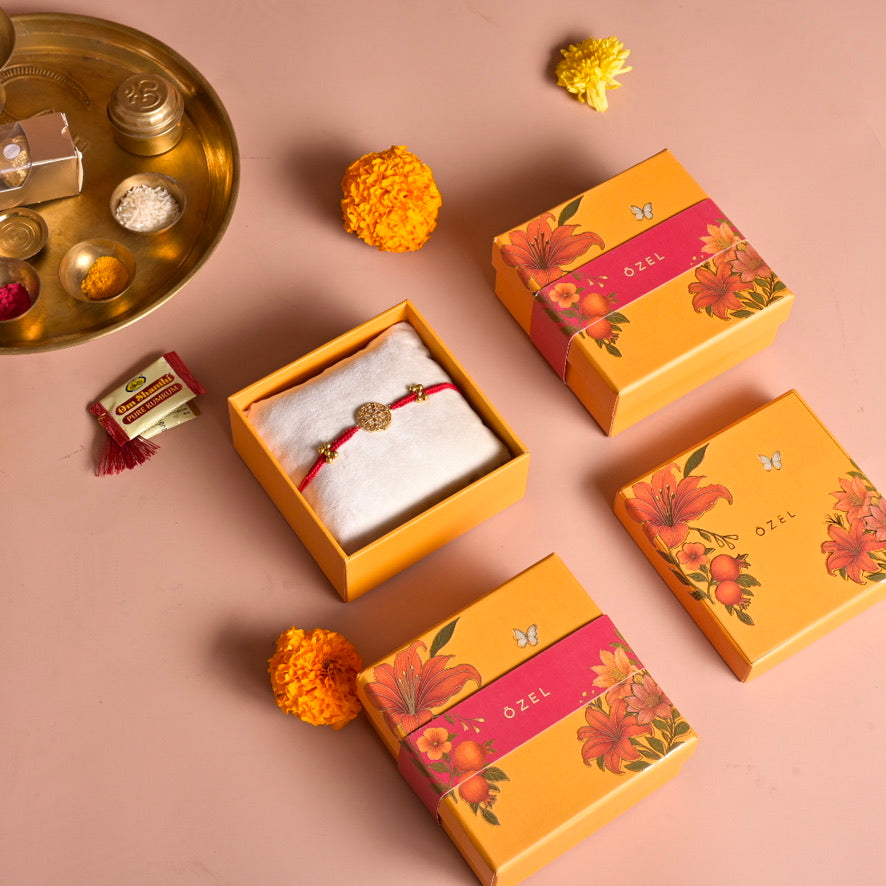 Gol chakra rakhi with red thread