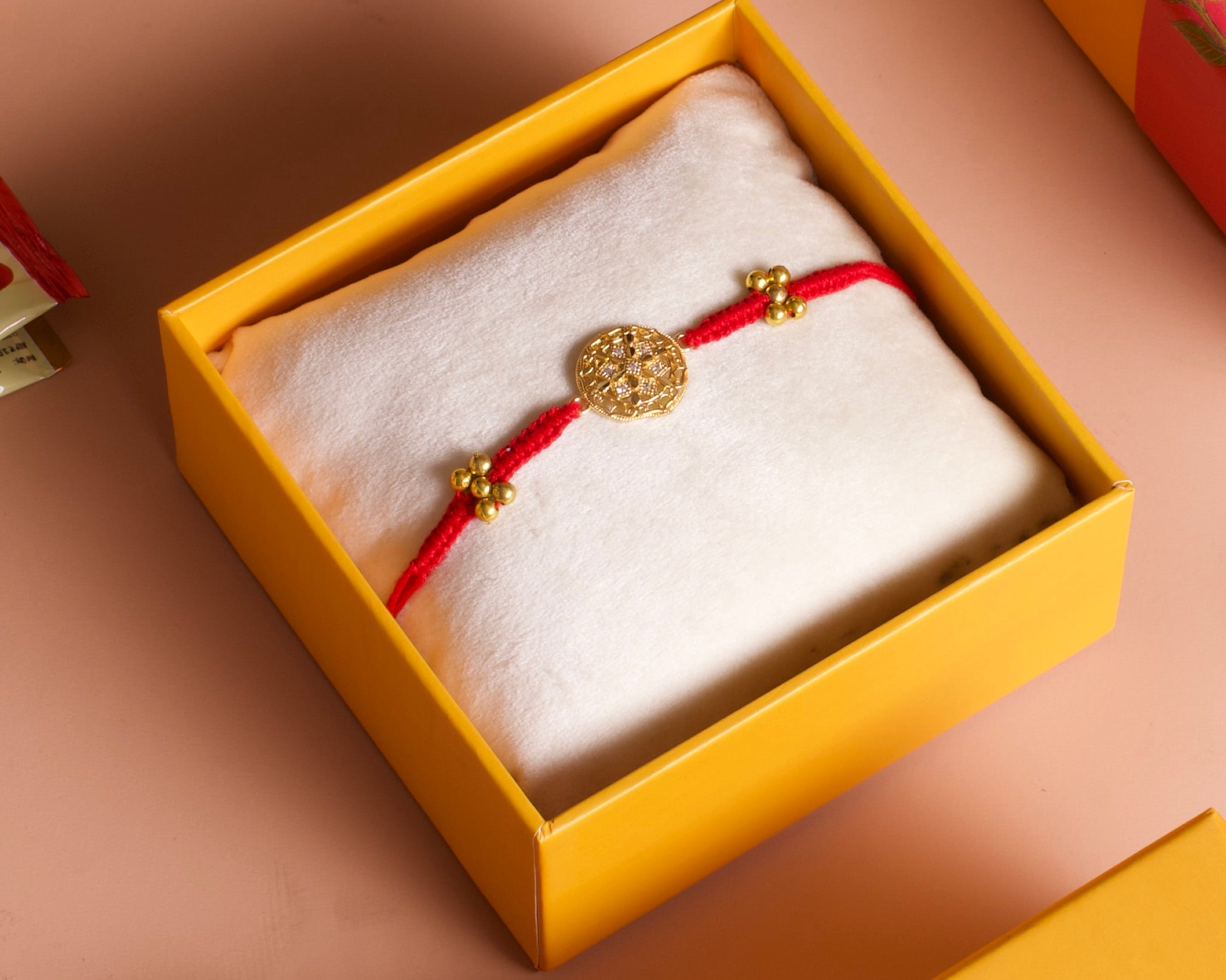 Gol chakra rakhi with red thread