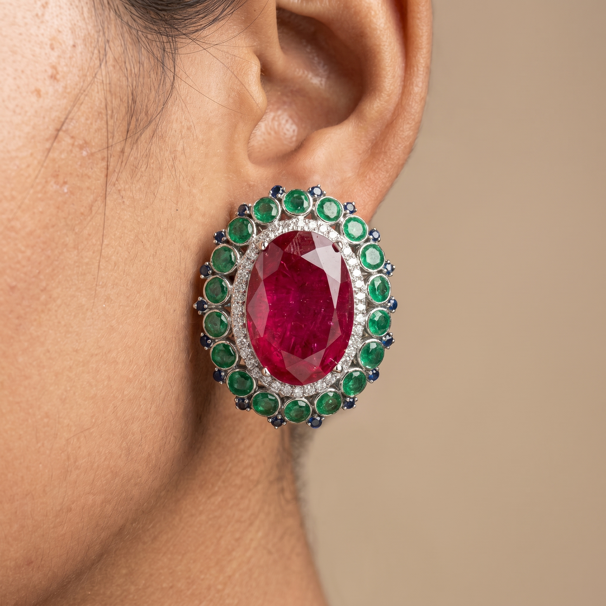 Ruby oval stud earrings with American diamond and emerald halo — Ozel