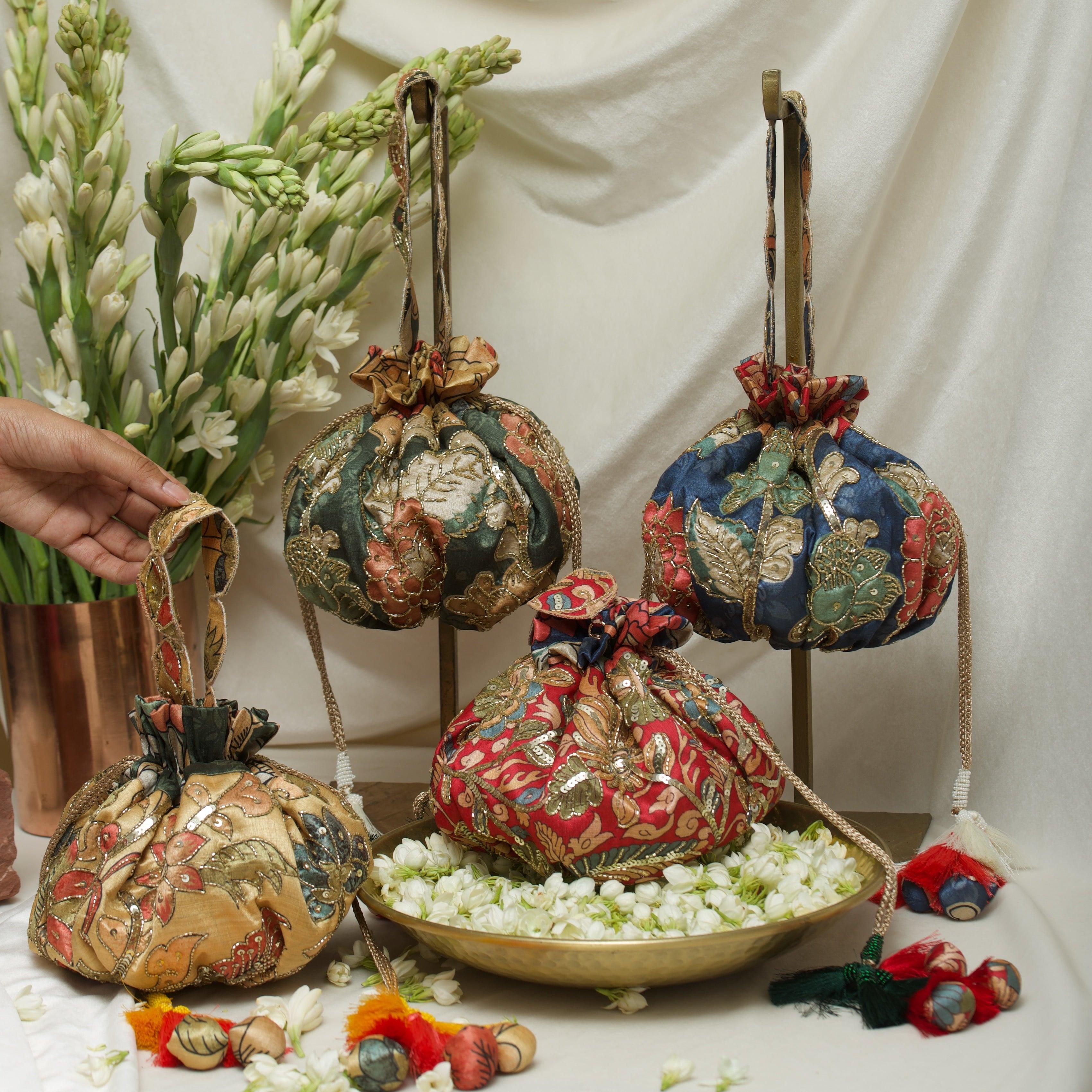 Kalamkari print embroidered gol potli bag - Ozel