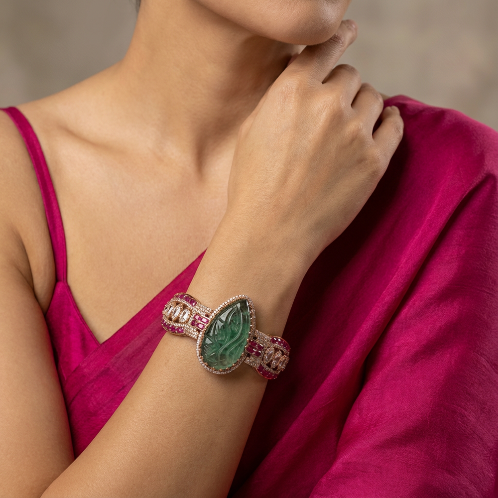Side view of Zehra emerald carved cuff — Ozel
