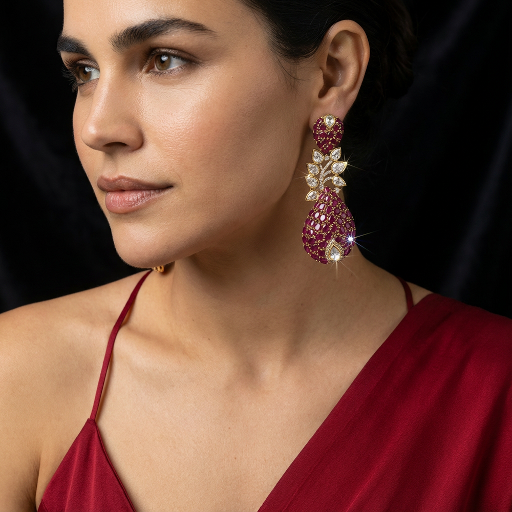Plum flare moissanite drop earrings – worn on ear by Ozel