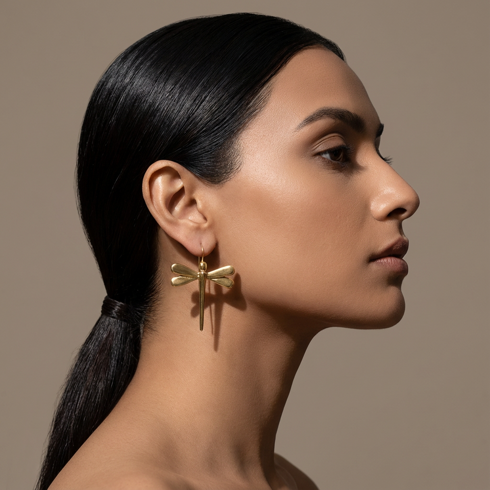 Gilded dragonfly drop earrings – worn on ear by Ozel