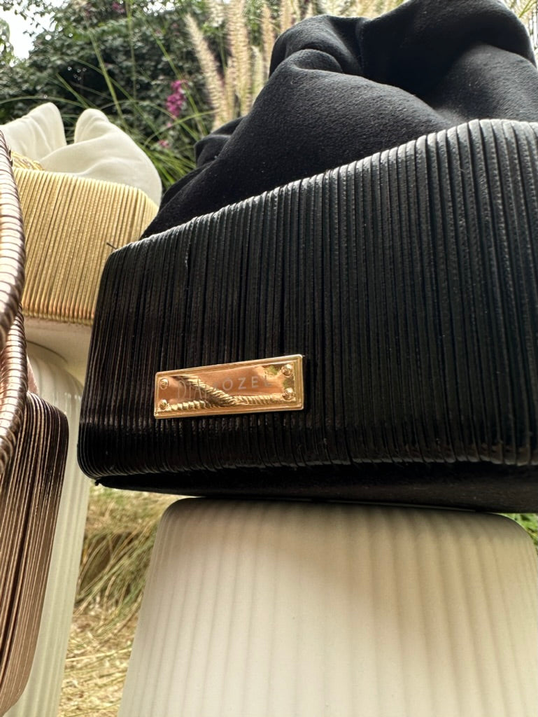 Cord bucket bag with 18kt gold and diamonds charm