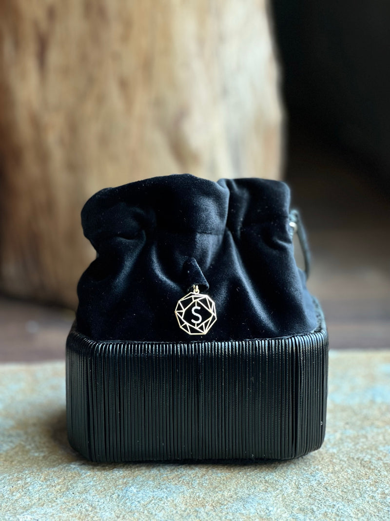Cord bucket bag with 18kt gold and diamonds charm