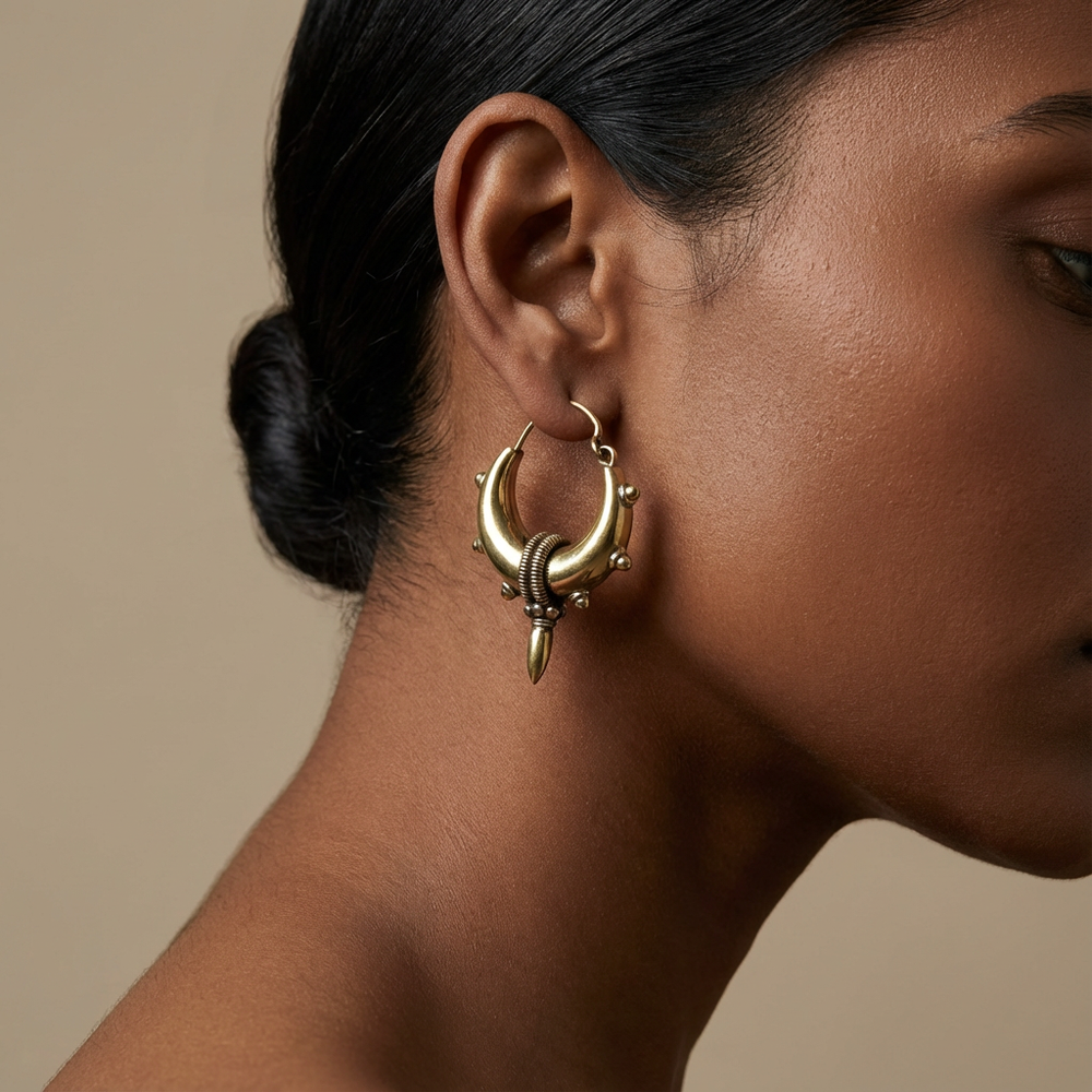 Crescent spike hoop earrings – worn on ear by Ozel