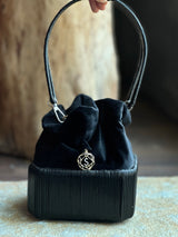Cord bucket bag with 18kt gold and diamonds charm