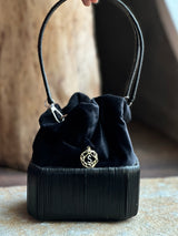 Cord bucket bag with 18kt gold and diamonds charm