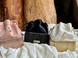 Cord bucket bag with 18kt gold and diamonds charm