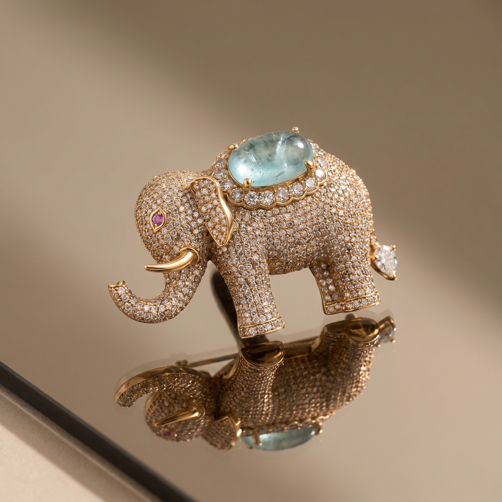 Crystal-studded elephant brooch with aqua gemstone centerpiece — Ozel