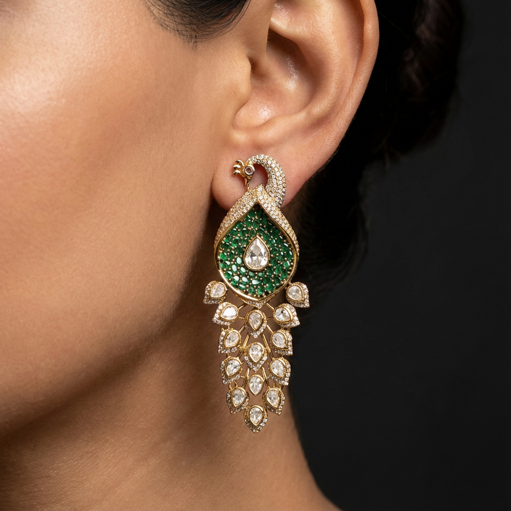 Peacock cascade drop earrings – worn on ear by Ozel