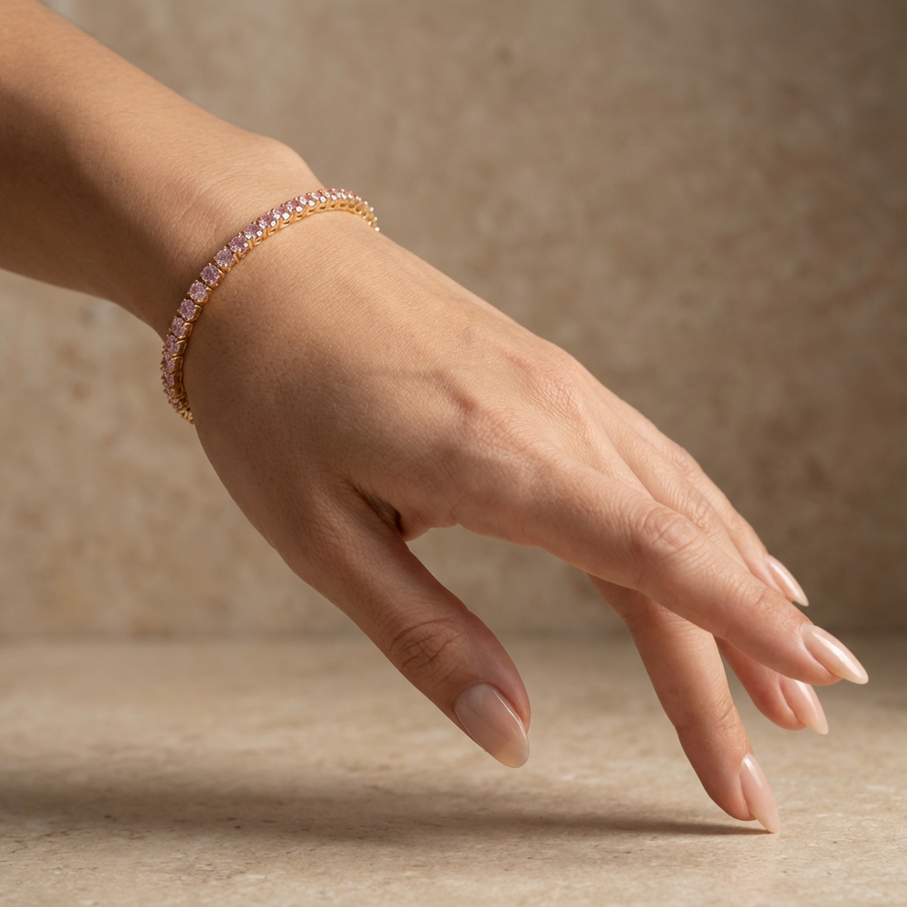 Pink tennis bracelet – styled on wrist by Ozel