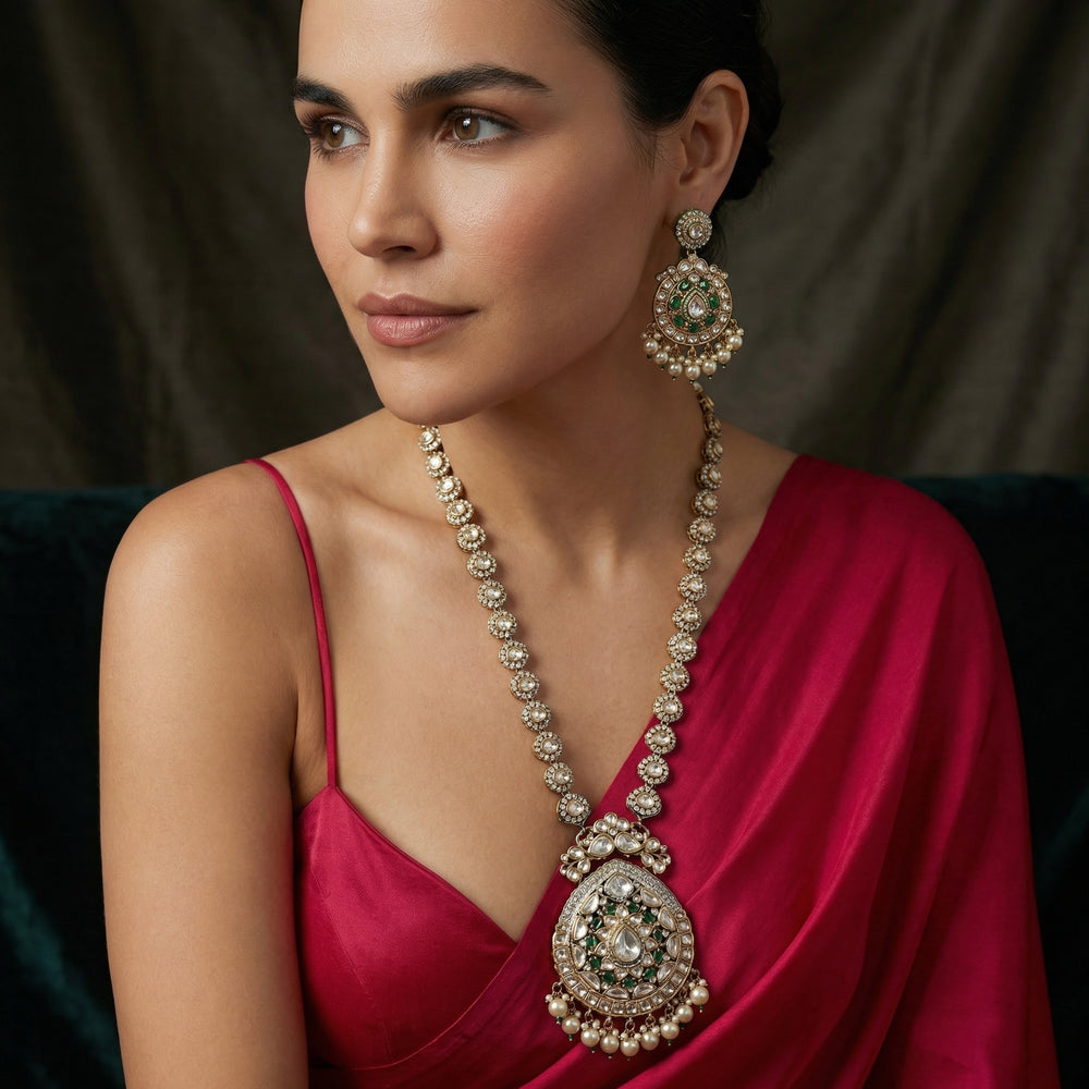 Kaniska Emerald Pendant Set with rich green stones and heritage gold detailing by Ozel